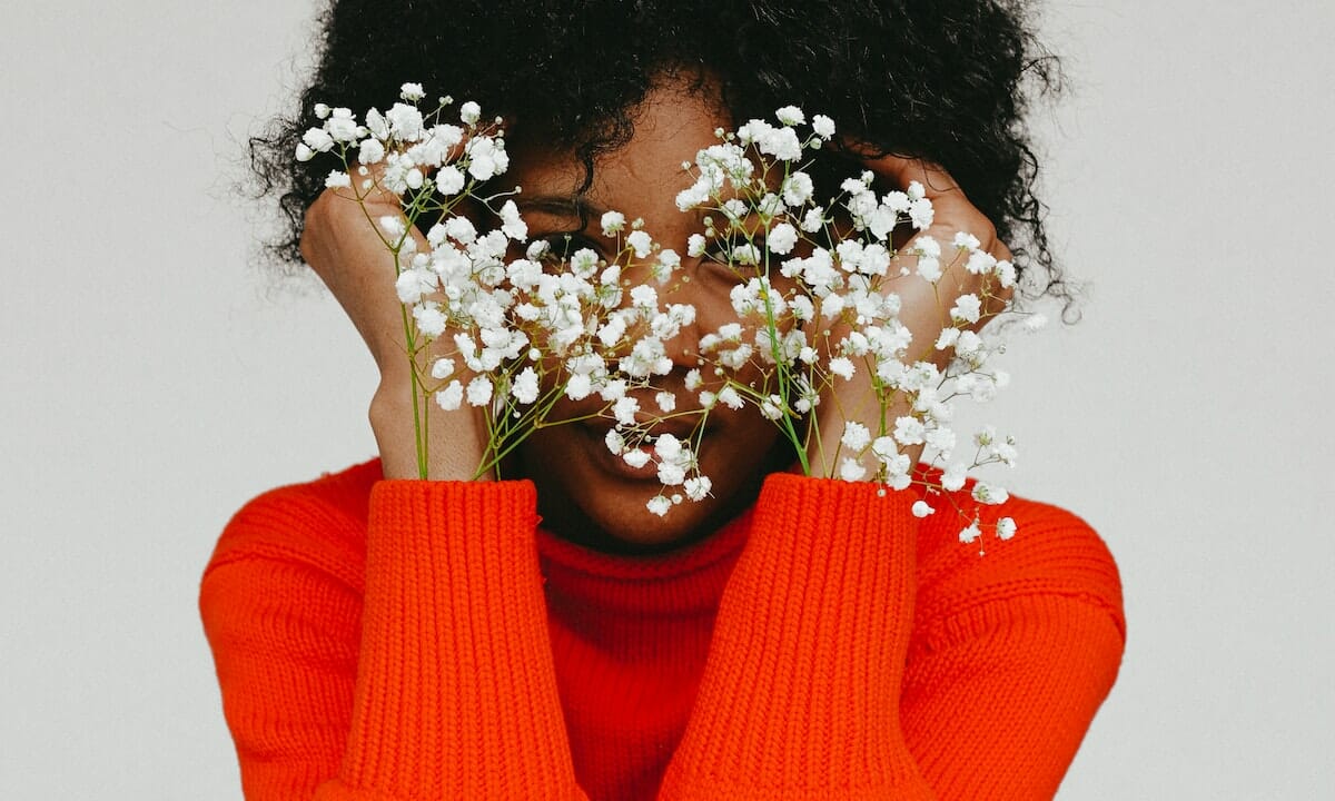 Il maglione rosso lacca è il must have delle feste